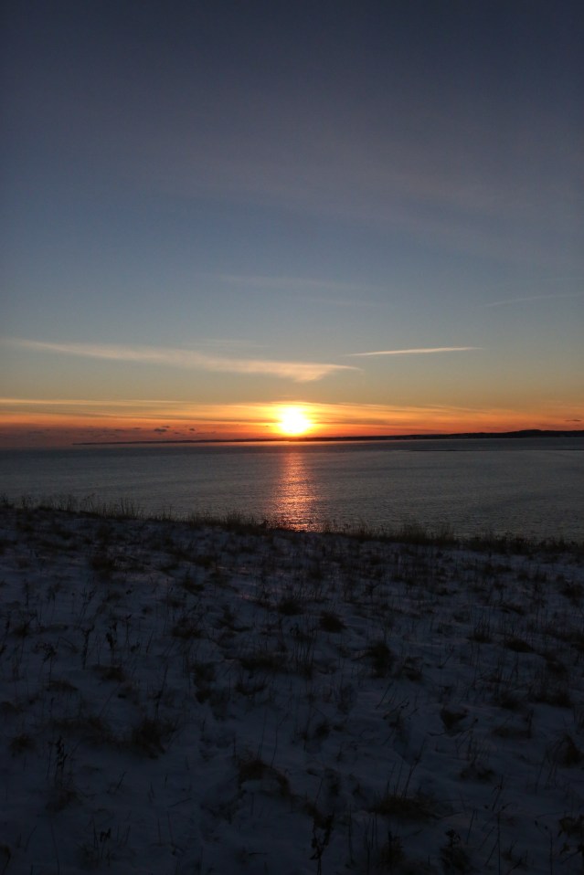 The sun sets over a stretch of water. Nova Scotia, Canada.