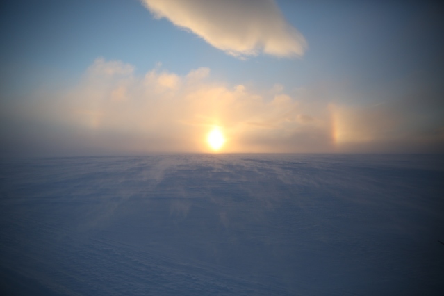 The midday sun skirts the horizon of the Canadian arctic. Ulukhaktok, Northwest Territories. 